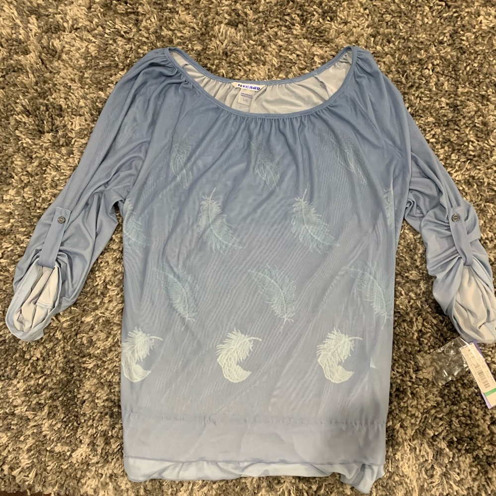 Blue Nygård blouse with a feather print.